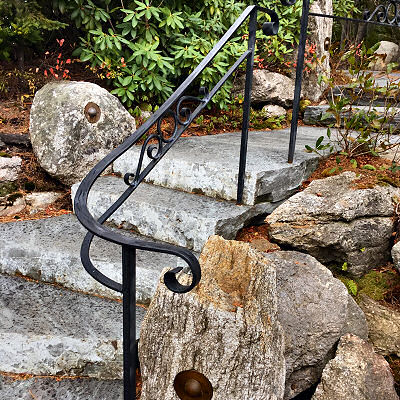 Railing along a custom stone stairway.