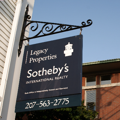 Hanging sign for Sotheby's Realty.