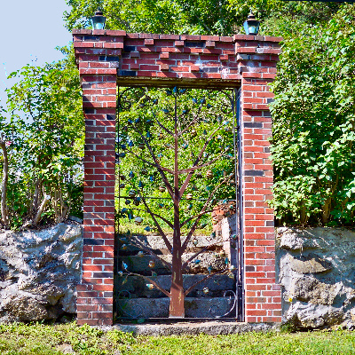 Tall gate with tree design.